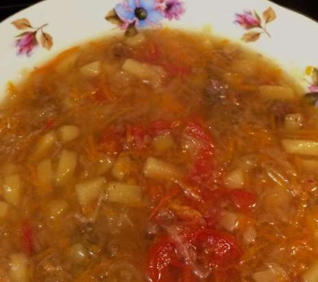 Cabbage soup with sauerkraut in a slow cooker