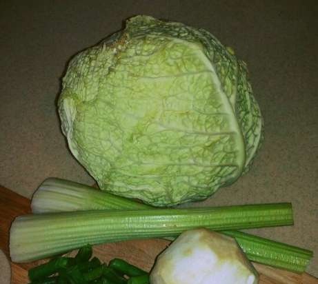 Savoy cabbage cabbage rolls with celery on a cushion of green beans in a multicooker Redmond RMC-M 4502