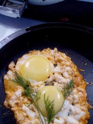 Curly fried eggs in broth