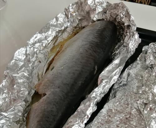 Herring with cheese baked in foil