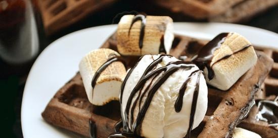 Chocolate waffles with nuts and sauce