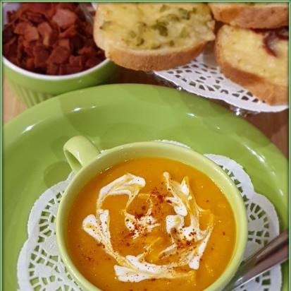 Pumpkin and carrot puree soup with ginger and cheese croutons