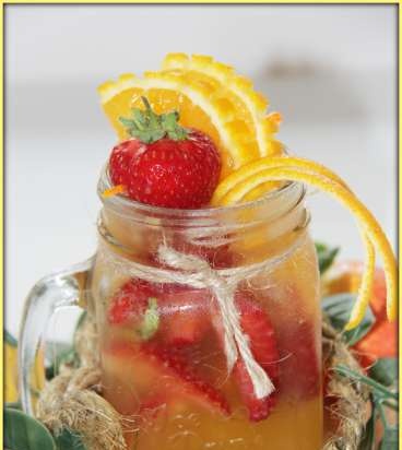 Orange lemonade with tangerine in a jar