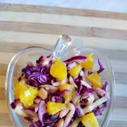 Red cabbage, apple and tangerine salad