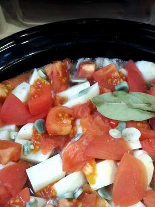 Pot of meat and vegetables with broth