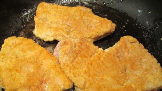 Pork chops baked with two cheeses