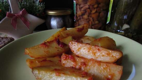 Patatas fragantes al horno en adobo de tomate