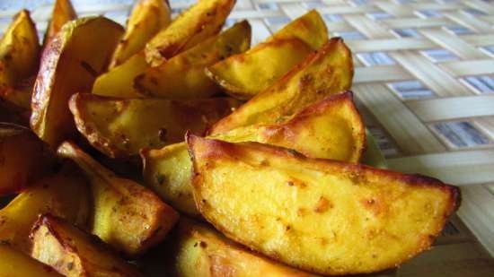 Gouden aardappelen gebakken in een boeket kruiden