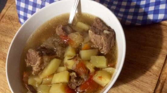 Cabbage soup with sauerkraut in a slow cooker