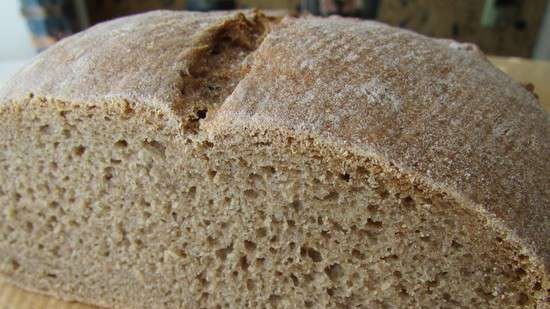 Dark rye-wheat bread on a big bag (oven)