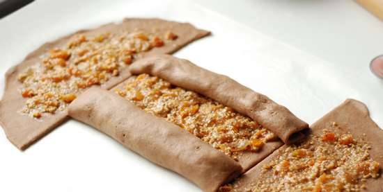 Rolled cake with dried apricots and almonds filling