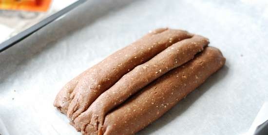 Rolled cake with dried apricots and almonds filling