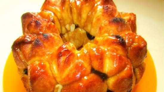 Monkey bread with toffee sauce, nuts and dried fruits