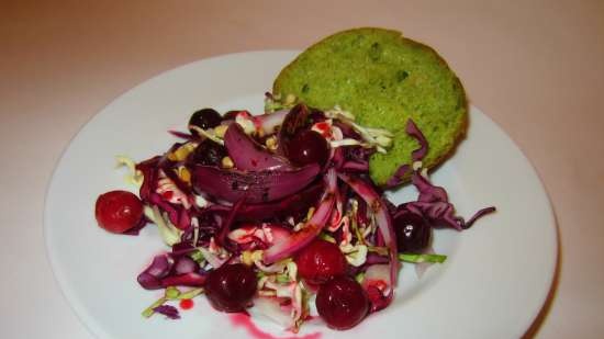 Salad of two types of cabbage with grilled onions and berry sauce on a bun made of aromatic herbs