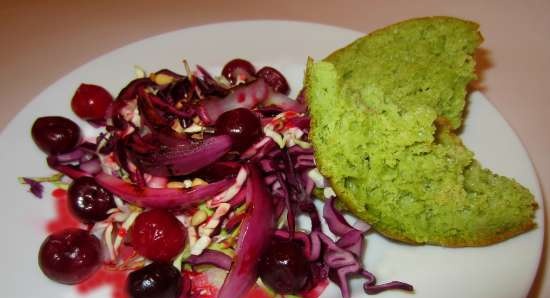 Salad of two types of cabbage with grilled onions and berry sauce on a bun made of aromatic herbs