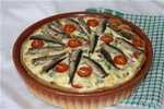 Quiche with sprats and cherry