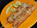 Salmon skewers in sesame breading