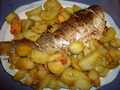 Carp baked with apples and potatoes