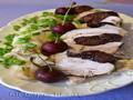 Chicken breast with prunes, under cabbage leaf, steamed