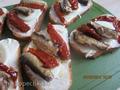 Sandwiches with sprats and sun-dried tomatoes