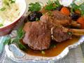 Veal stew with prunes (in a cast iron)