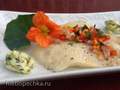 Halibut fillet (baked or steamed) under a vegetable coat with spiced oil (nasturtium)