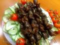 Smoked giblets skewers in a smokehouse with a water seal