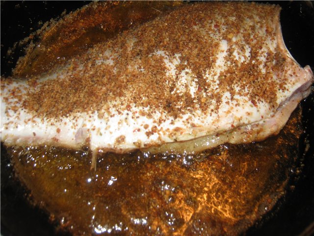 Crucian carp baked in sour cream with mushrooms