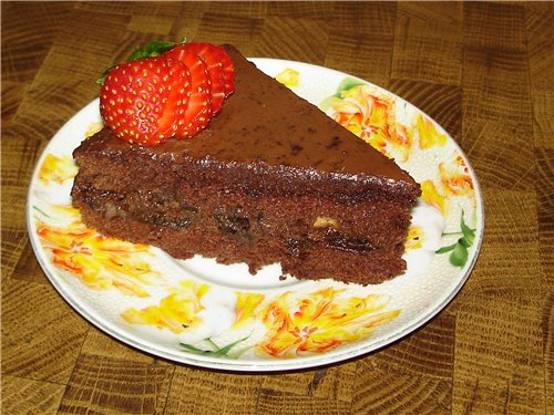 Chocolate-covered prune cake on a biscuit