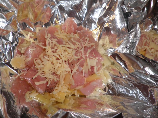 Chicken fillet with cherry and cheese, baked in foil