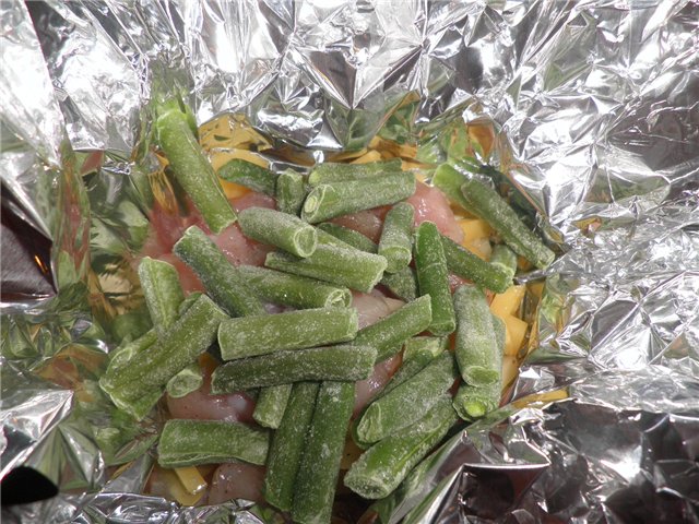 Chicken fillet with green beans baked in foil