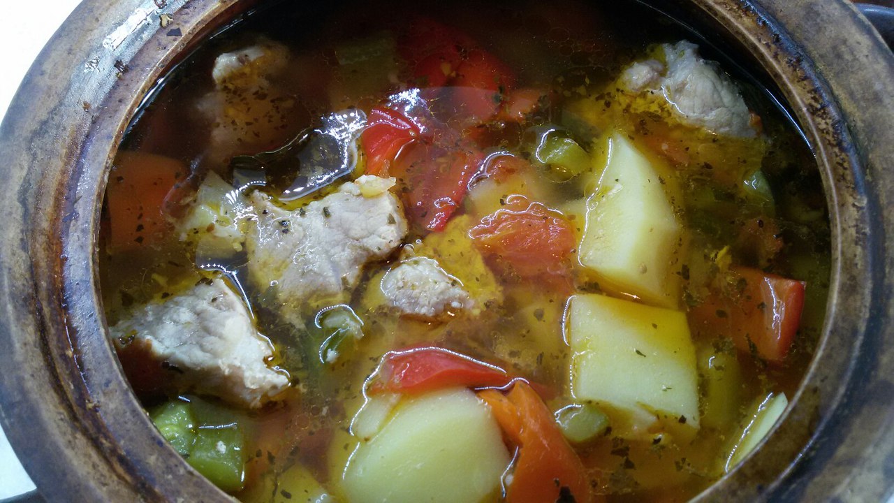 Pot of meat and vegetables with broth