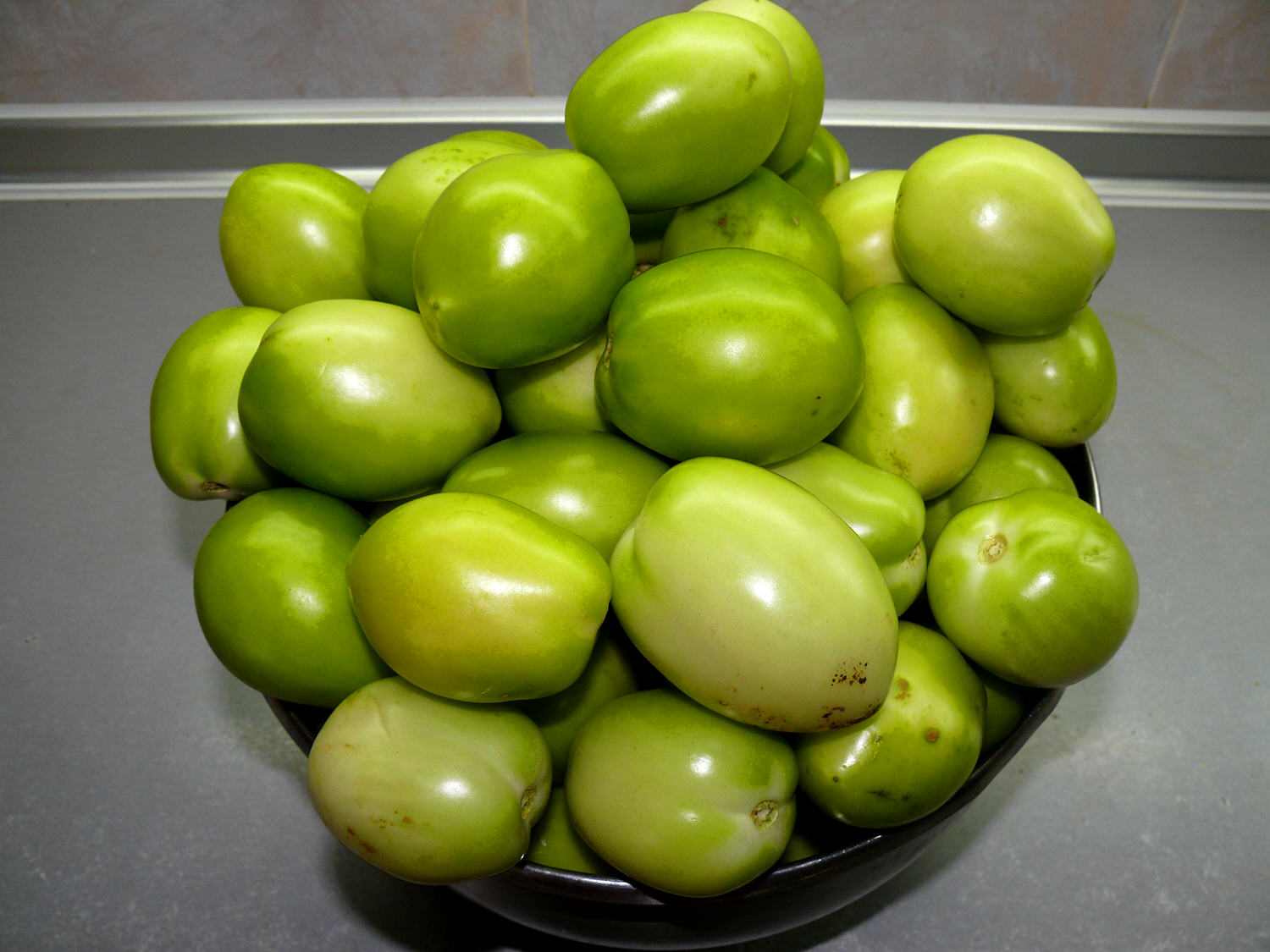 Tomàquets secs al forn amb oli perfumat (cocció i conserva)