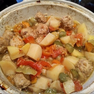 Pot of meat and vegetables with broth