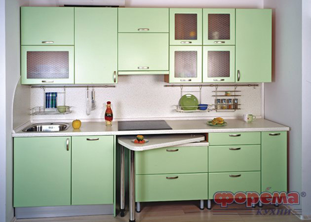 El sueño de Maniac. Cocina en colores verde claro y naranja.