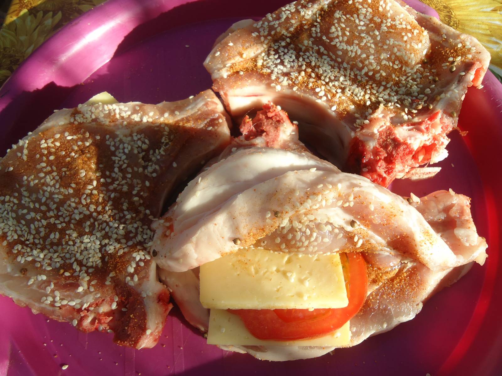 Pork chop stuffed with grilled cheese and tomato