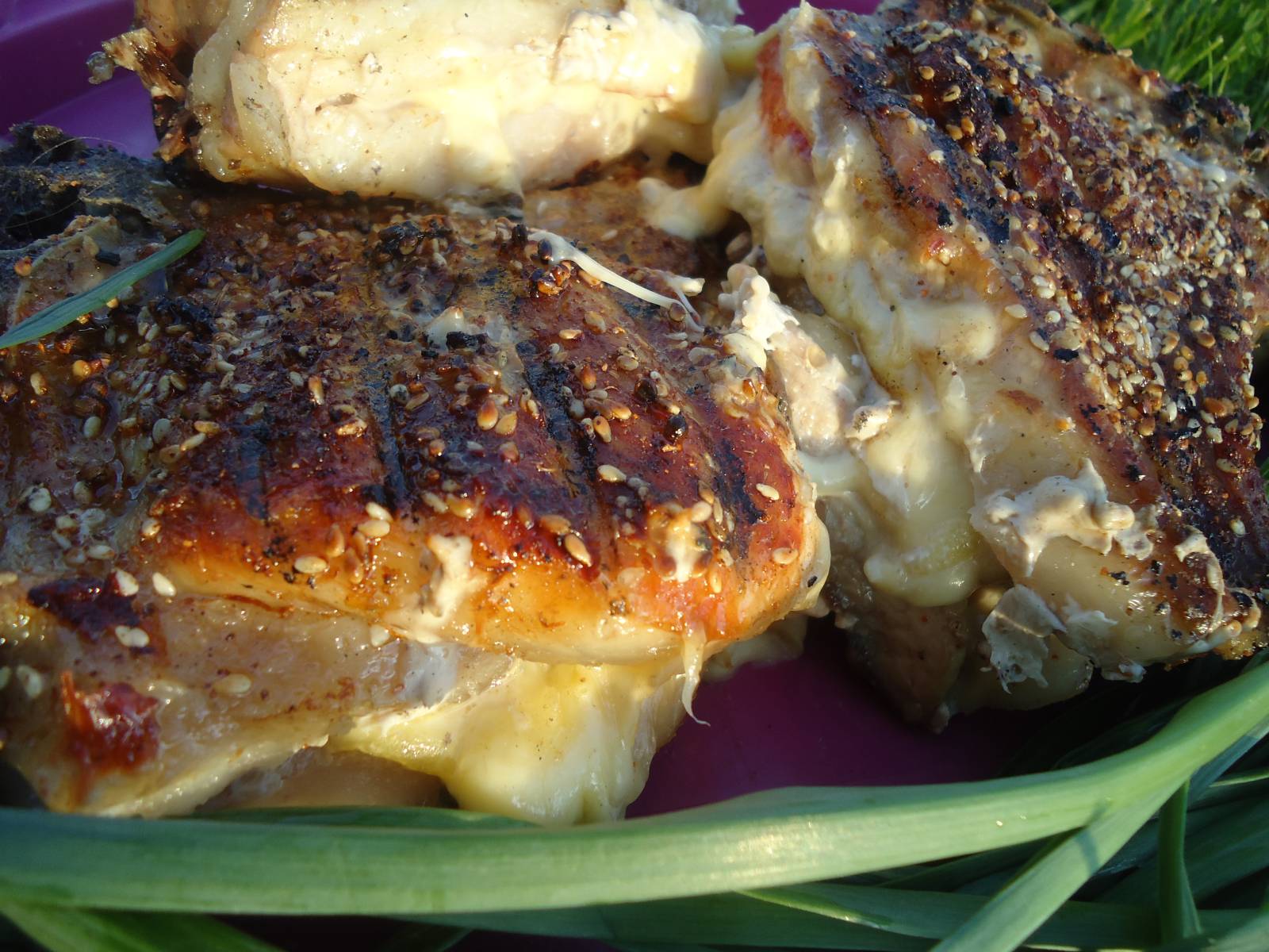 Pork chop stuffed with grilled cheese and tomato