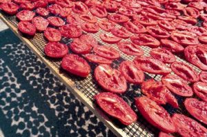 Sun-dried tomatoes in the oven in fragrant oil (cooking and canning)