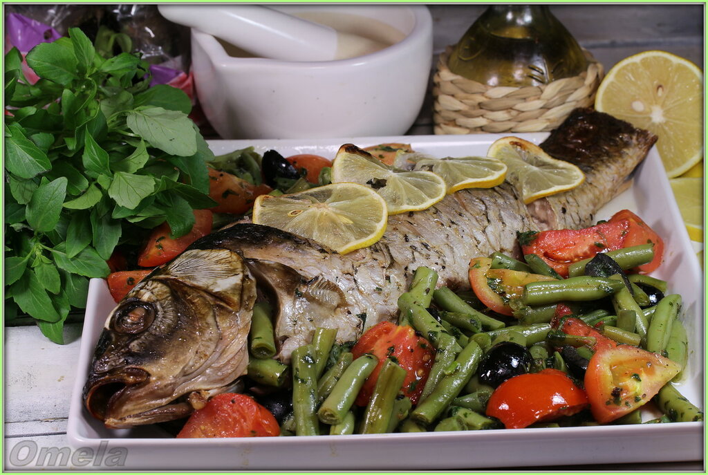 Carp (carp) with vegetables in basil sauce